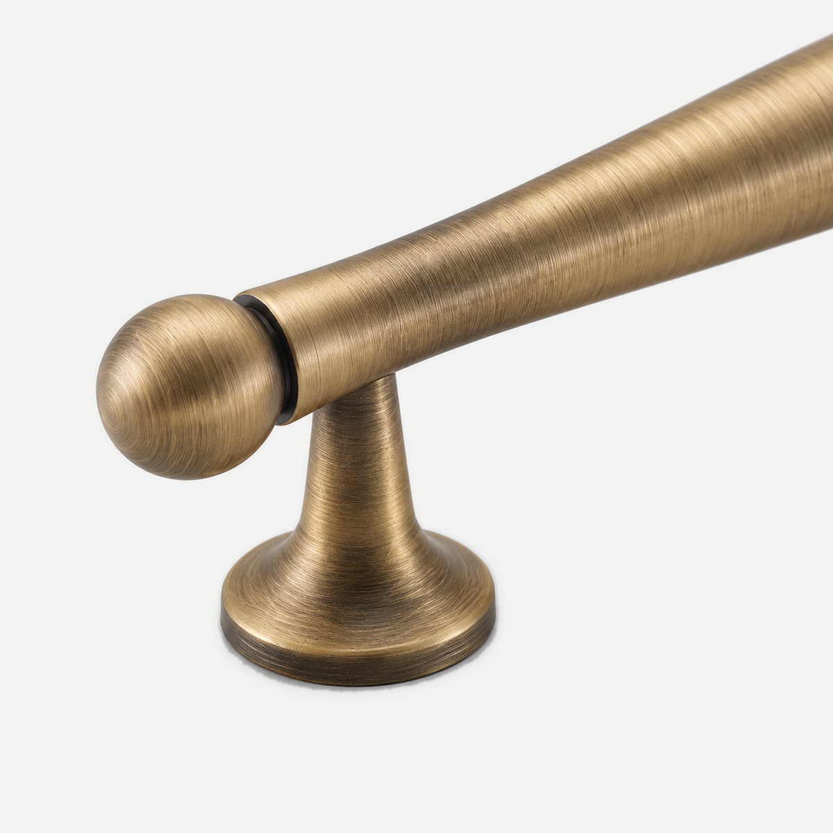 Brushed bronze pull - plain ball terminal and bell-foot detail