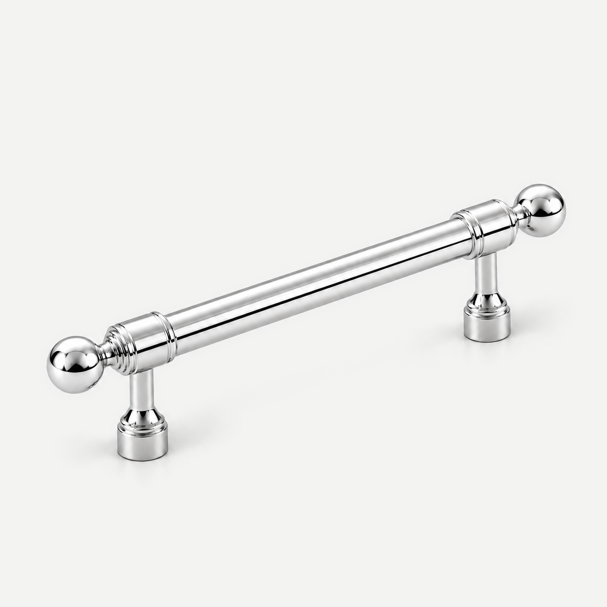 Bright silver brass cabinet handle — diagonal view of smooth grip, round ball ends and two mounting feet