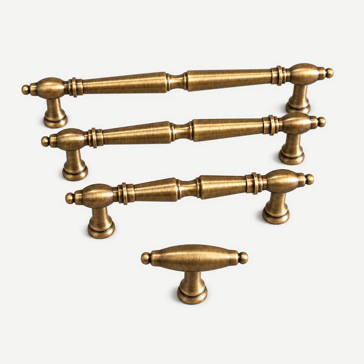 Antique brass cabinet handles and T knob — original photograph with light grey background