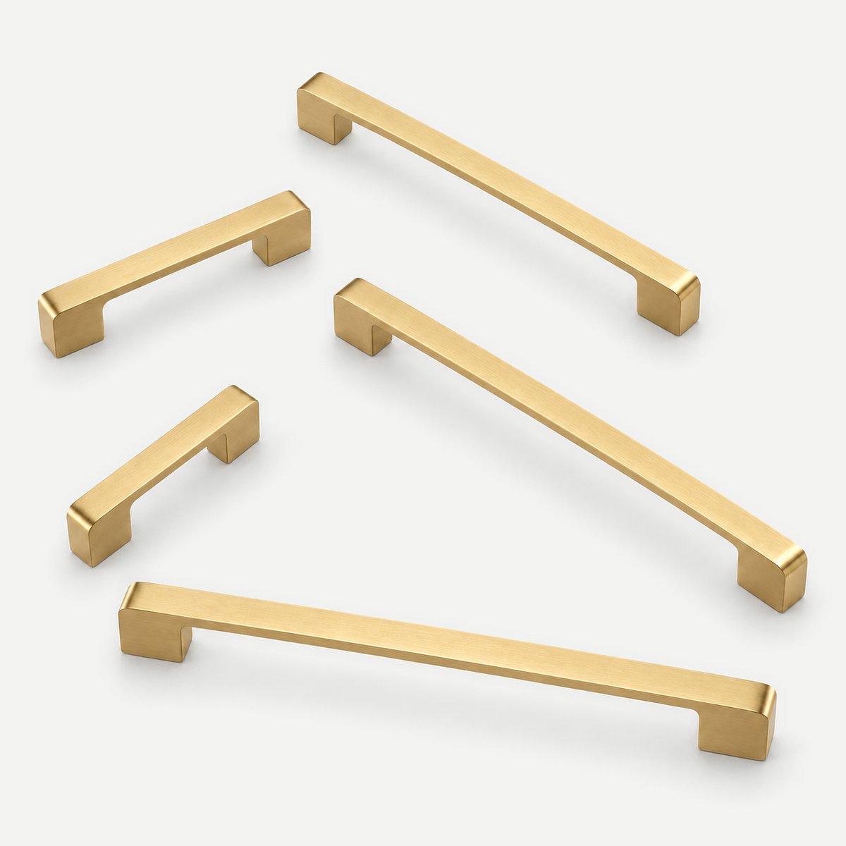 Gold flat cabinet pulls - five sizes in an asymmetrical arrangement