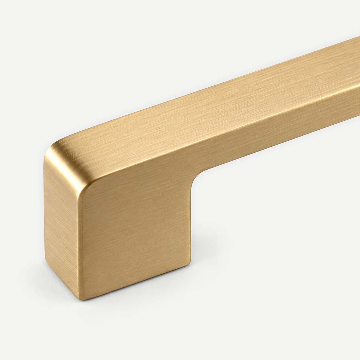 Gold cabinet pull - integral mounting leg and brushed edge detail