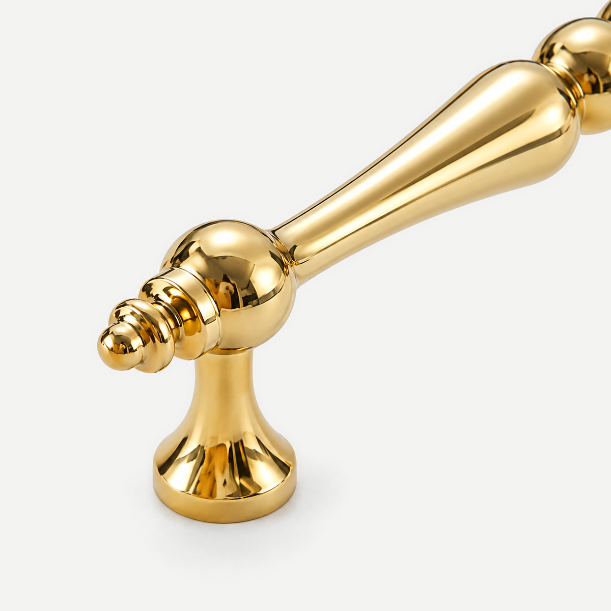 Gold cabinet handle - end joint and mounting foot detail