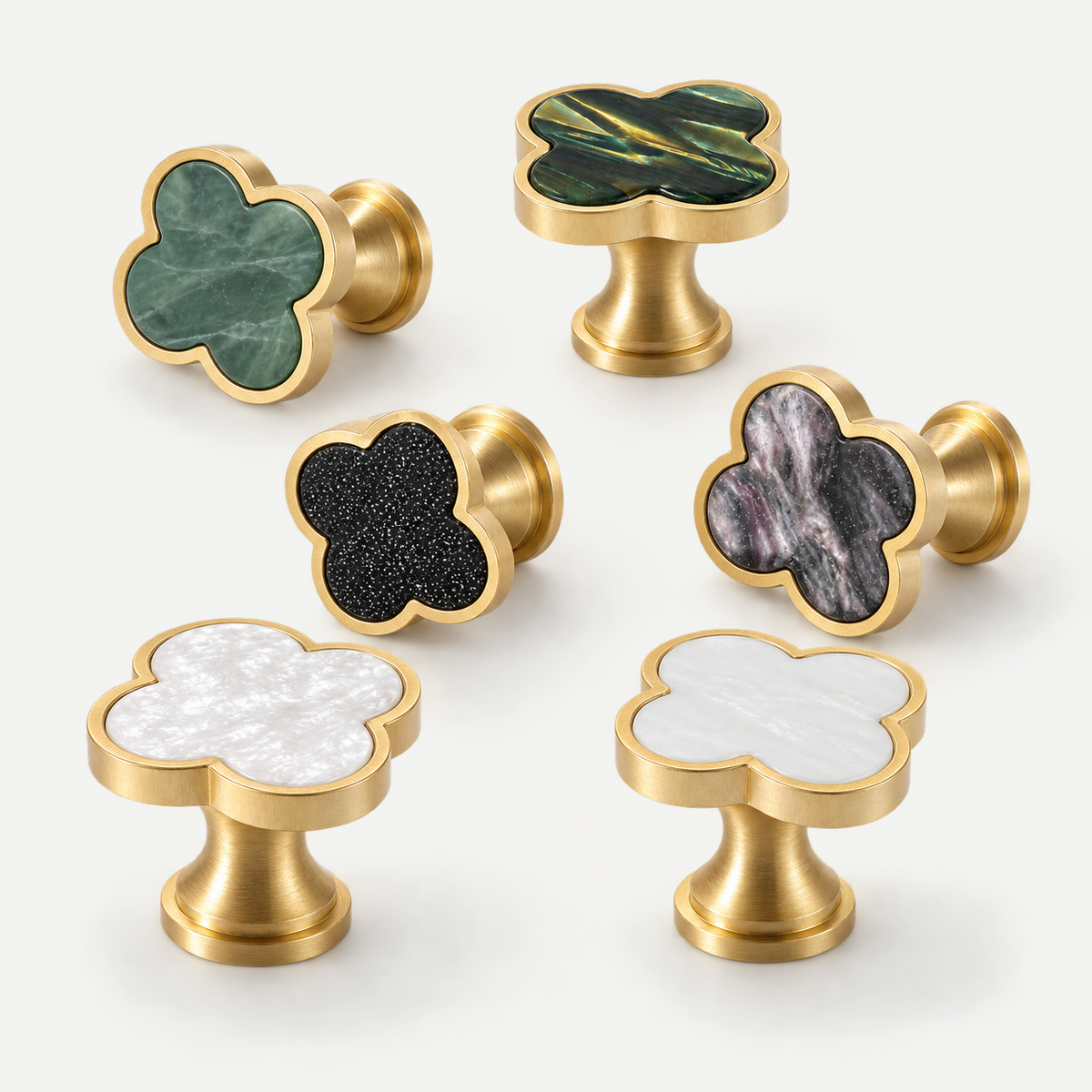 Quatre clover cabinet knobs - six actual colours in natural standing and side-resting arrangement