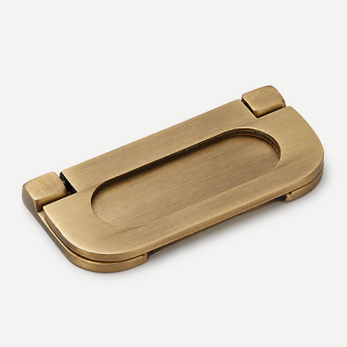 Antique brass oval fold-down pull - single angled close view